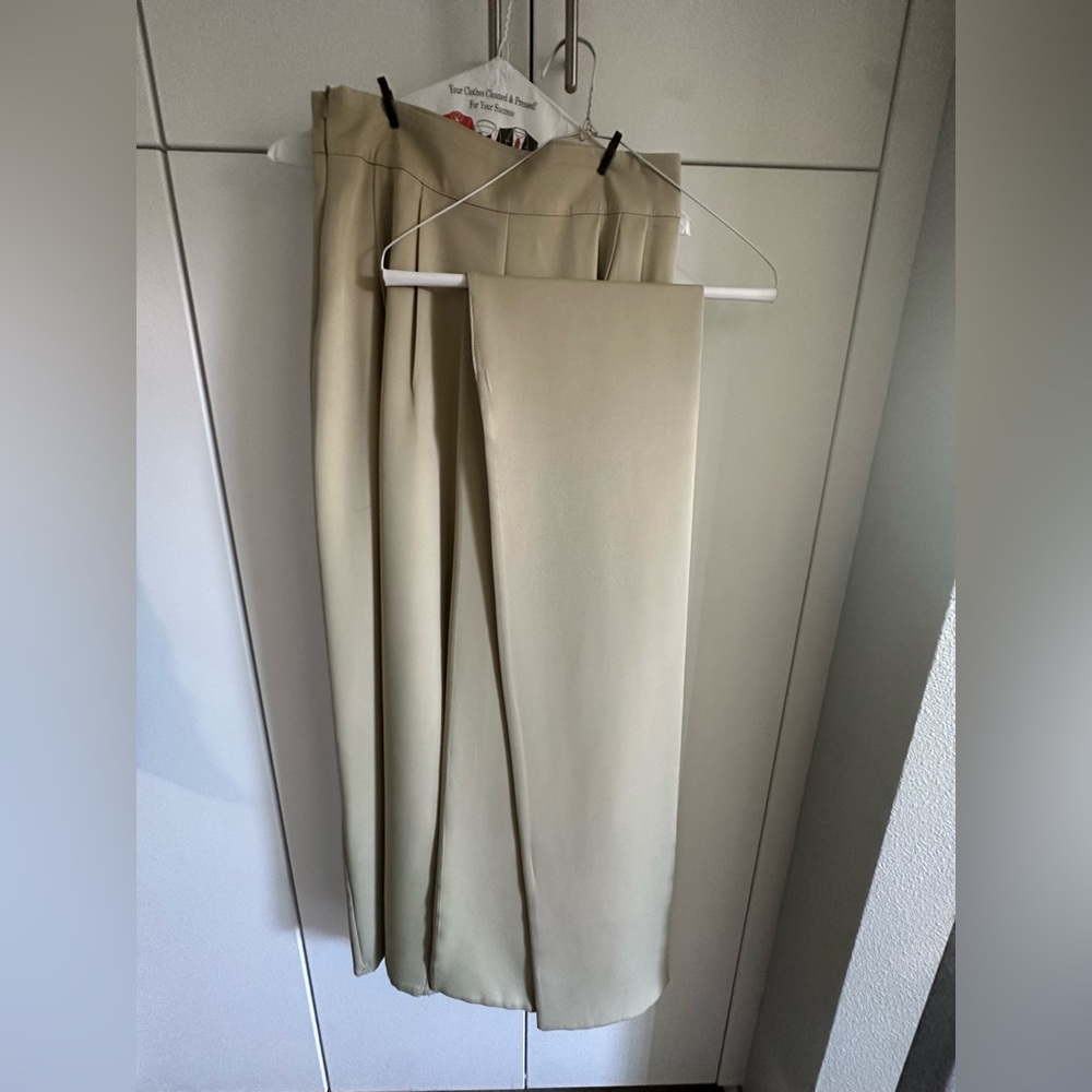 Olive colored two piece wide leg pant set and crop top.